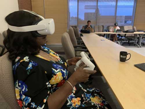 MGA graduate student Mary Neville uses the VR headset.